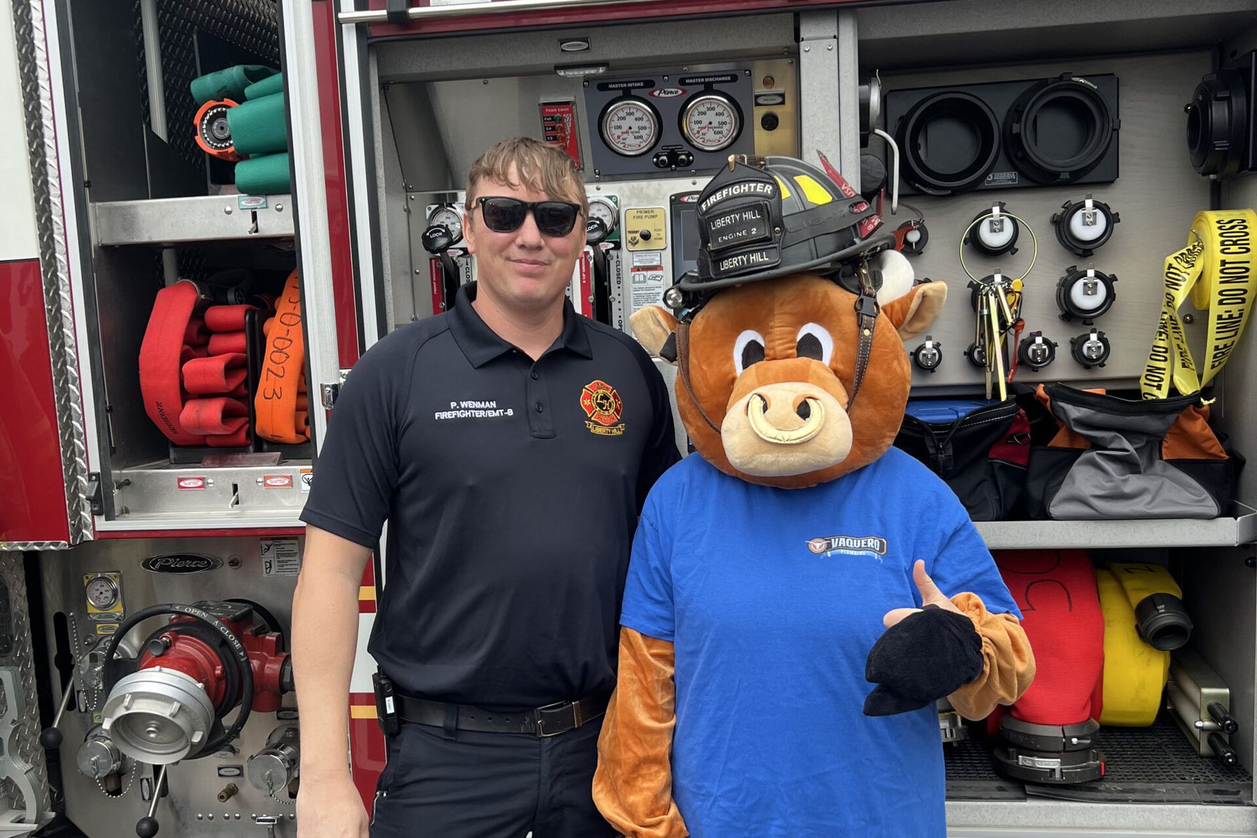 The Vaquero mascot with a Williamson County firefighter