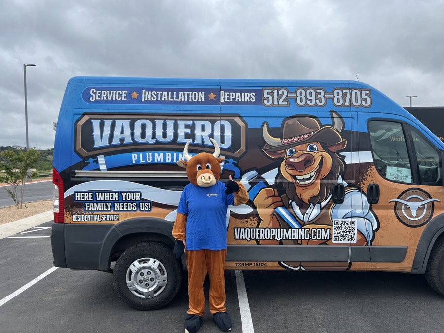 Vaquero Plumbing branded service van with mascot