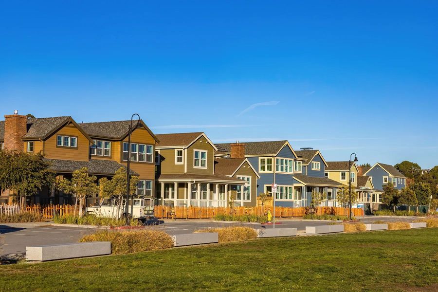 New suburban homes under a blue sky in Pflugerville, Texas